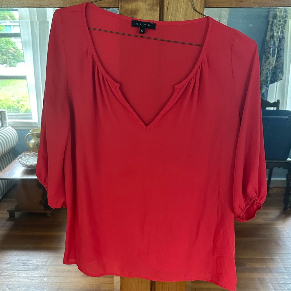 Glam orange three quarter length sleeved top. Size medium.